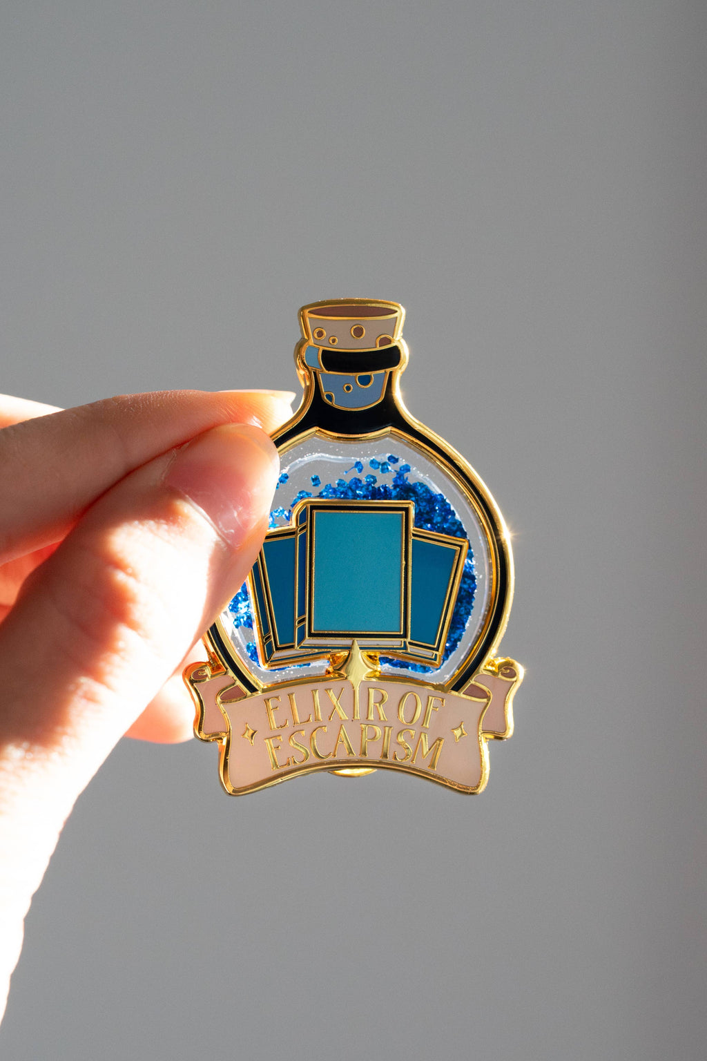 Elixir of Escapism Liquid Glitter Enamel Pin | Bookish Book