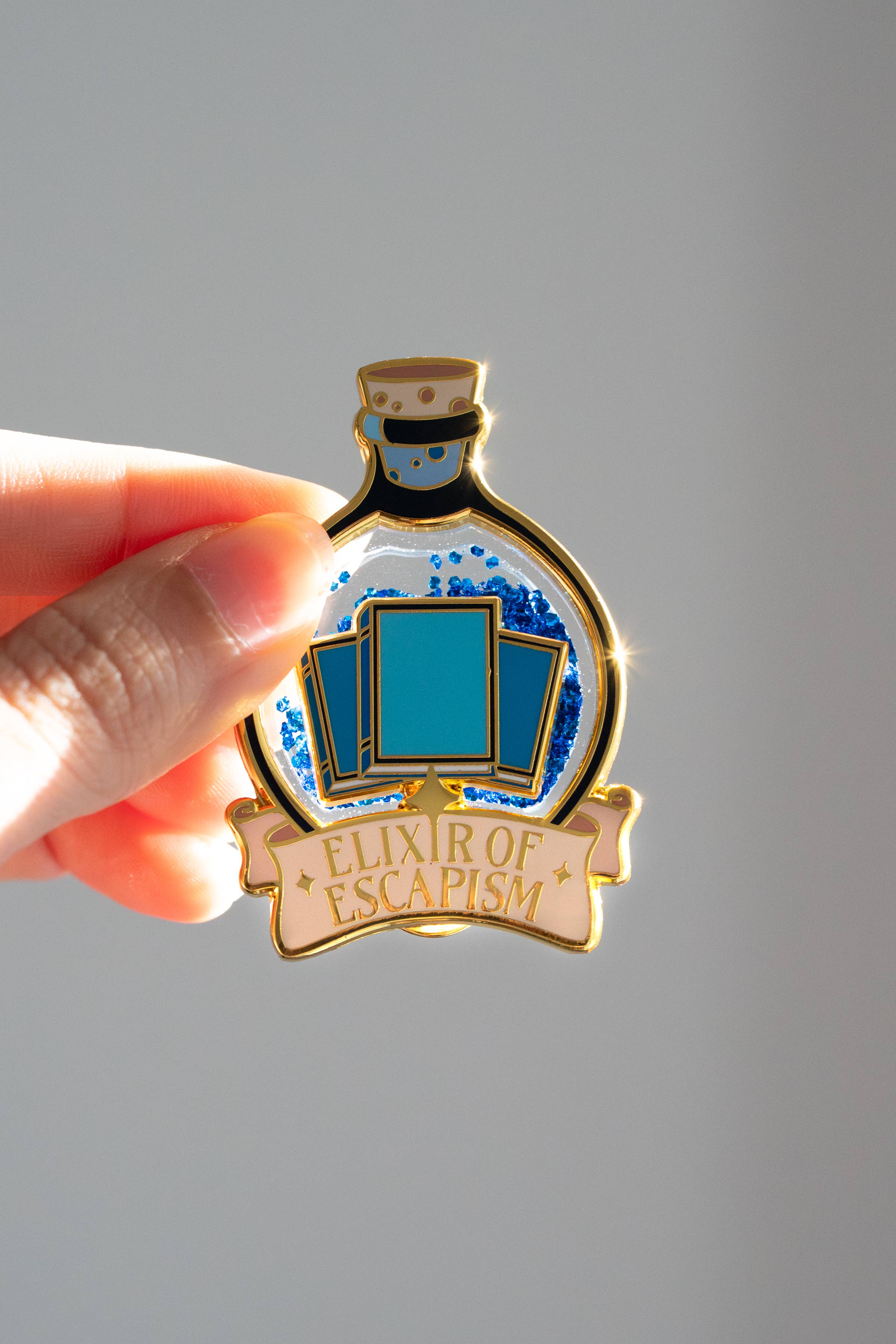Elixir of Escapism Liquid Glitter Enamel Pin | Bookish Book